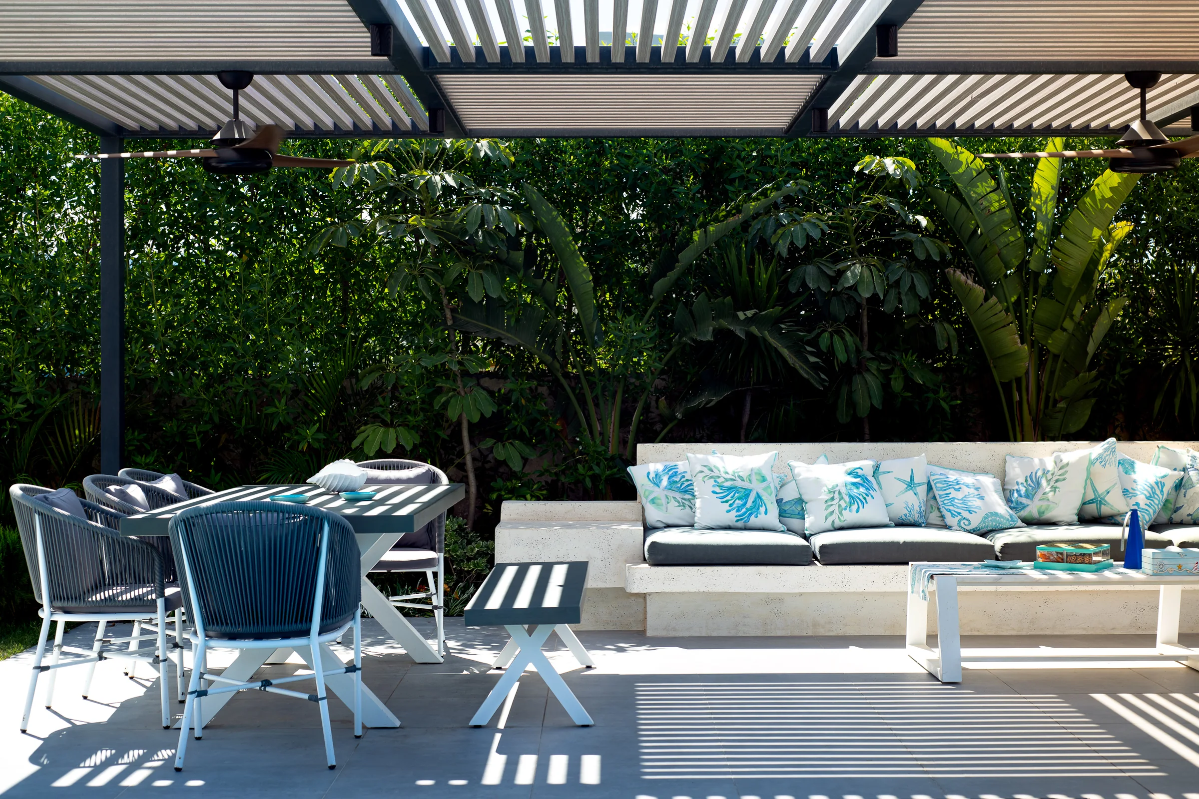 Dining and seating on the terrace in full sun.