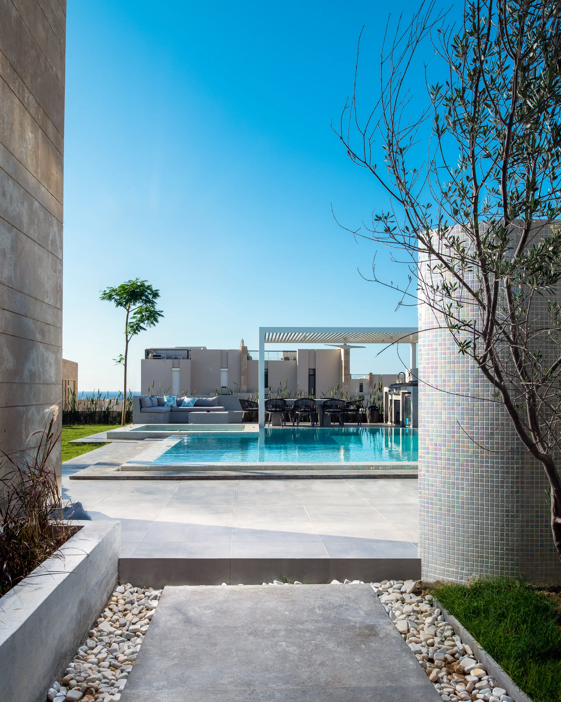 The path to the pool at dusk, render and planting either side.
