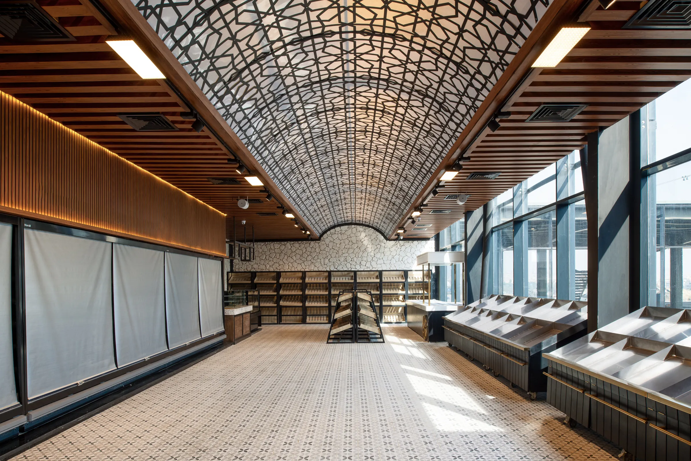 The vaulted hall, its perforated ceiling running the length of the market.