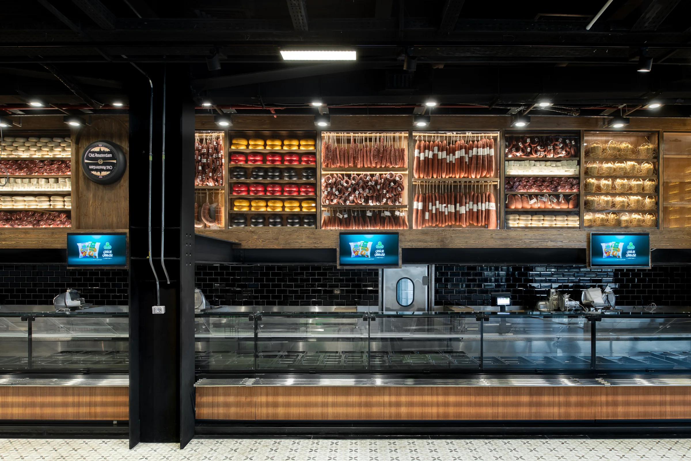 The same counter square on, glass cabinets lit from within.