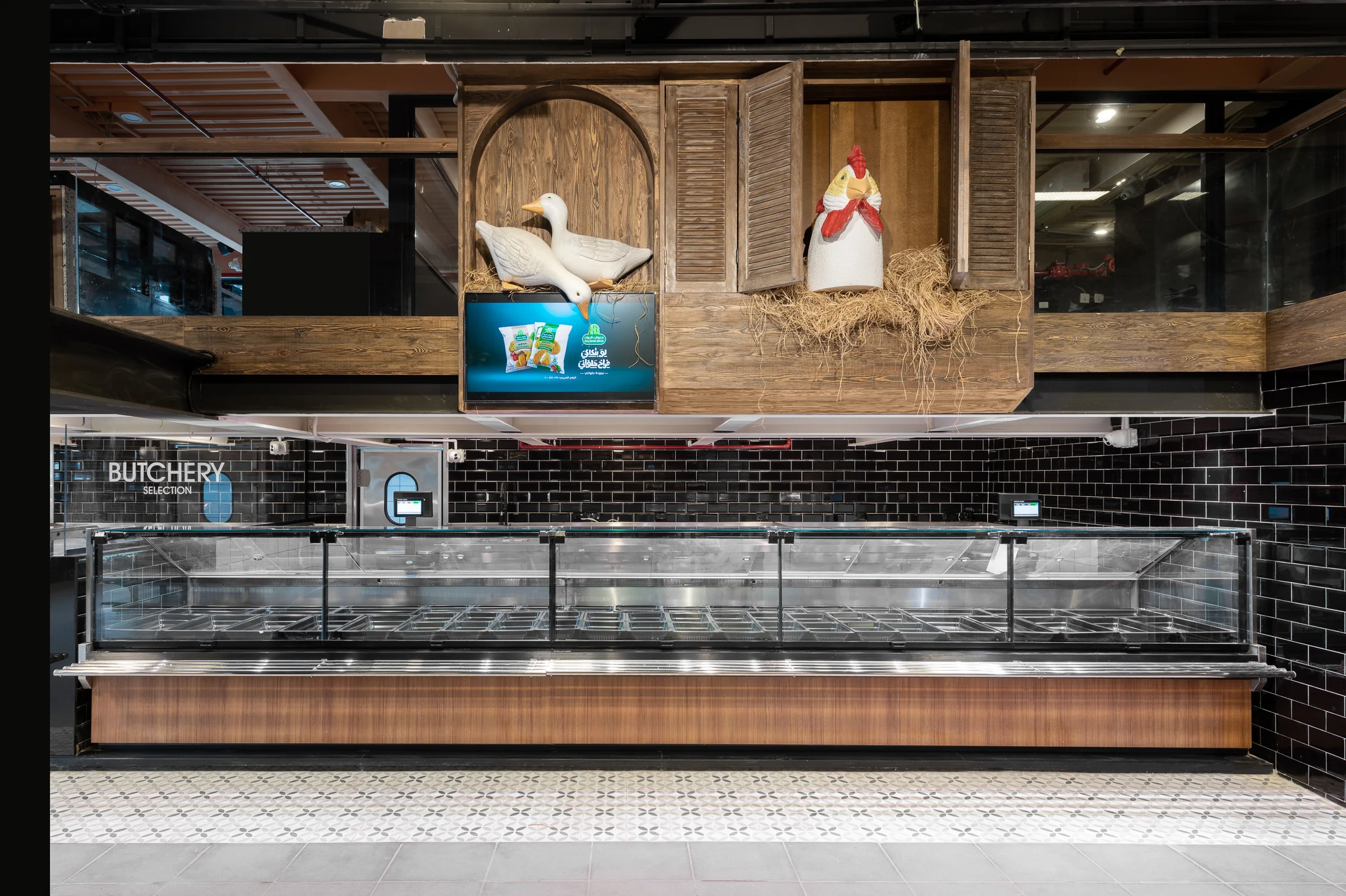 Poultry counter with its painted sign above.