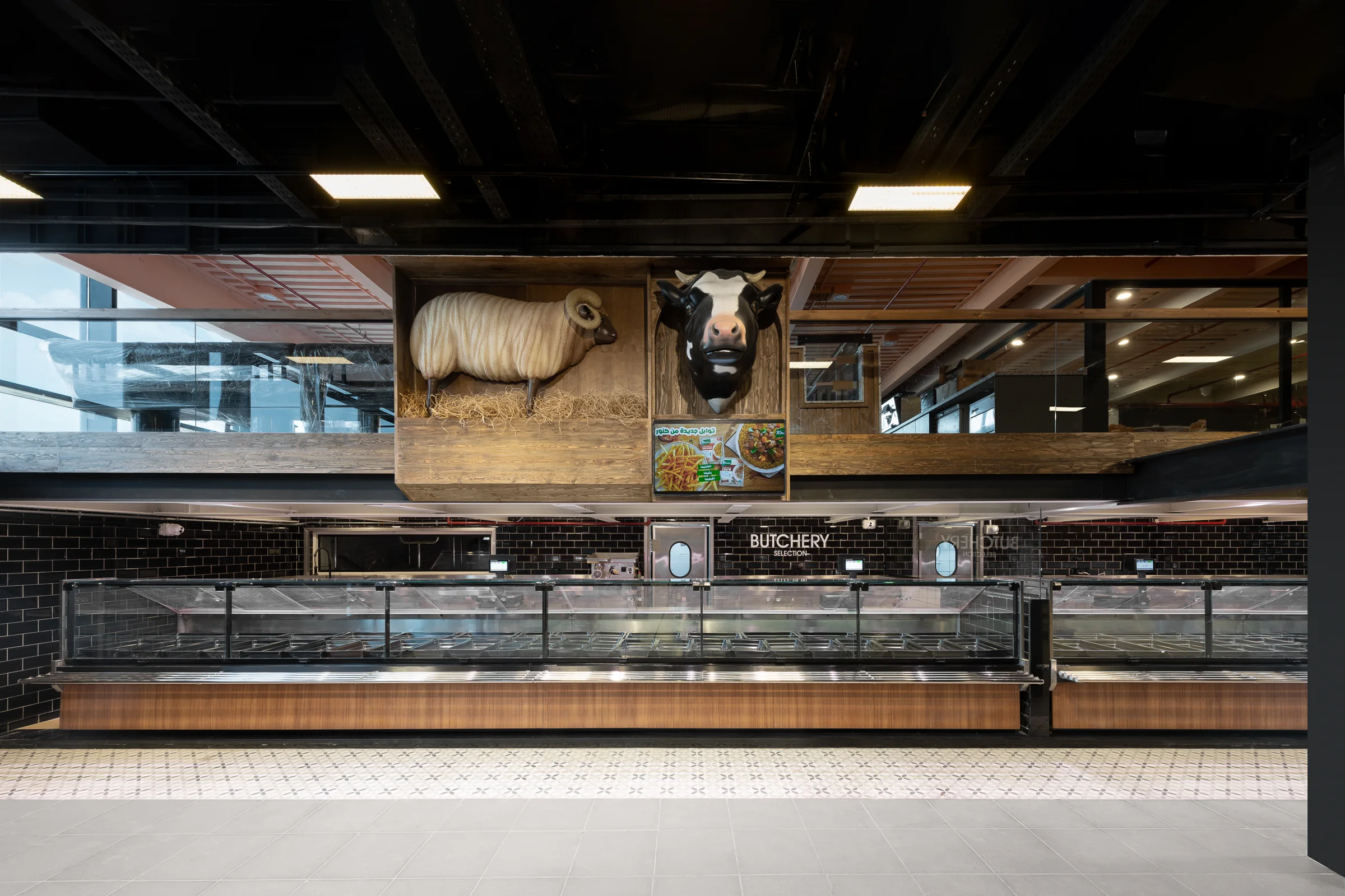 Butchery from the side, cabinets and screens lit.