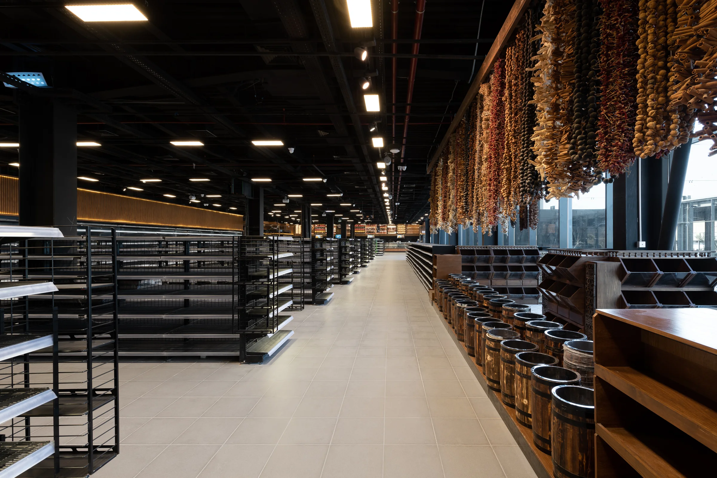 The aisle from the end, hanging stock and shelving in perspective.