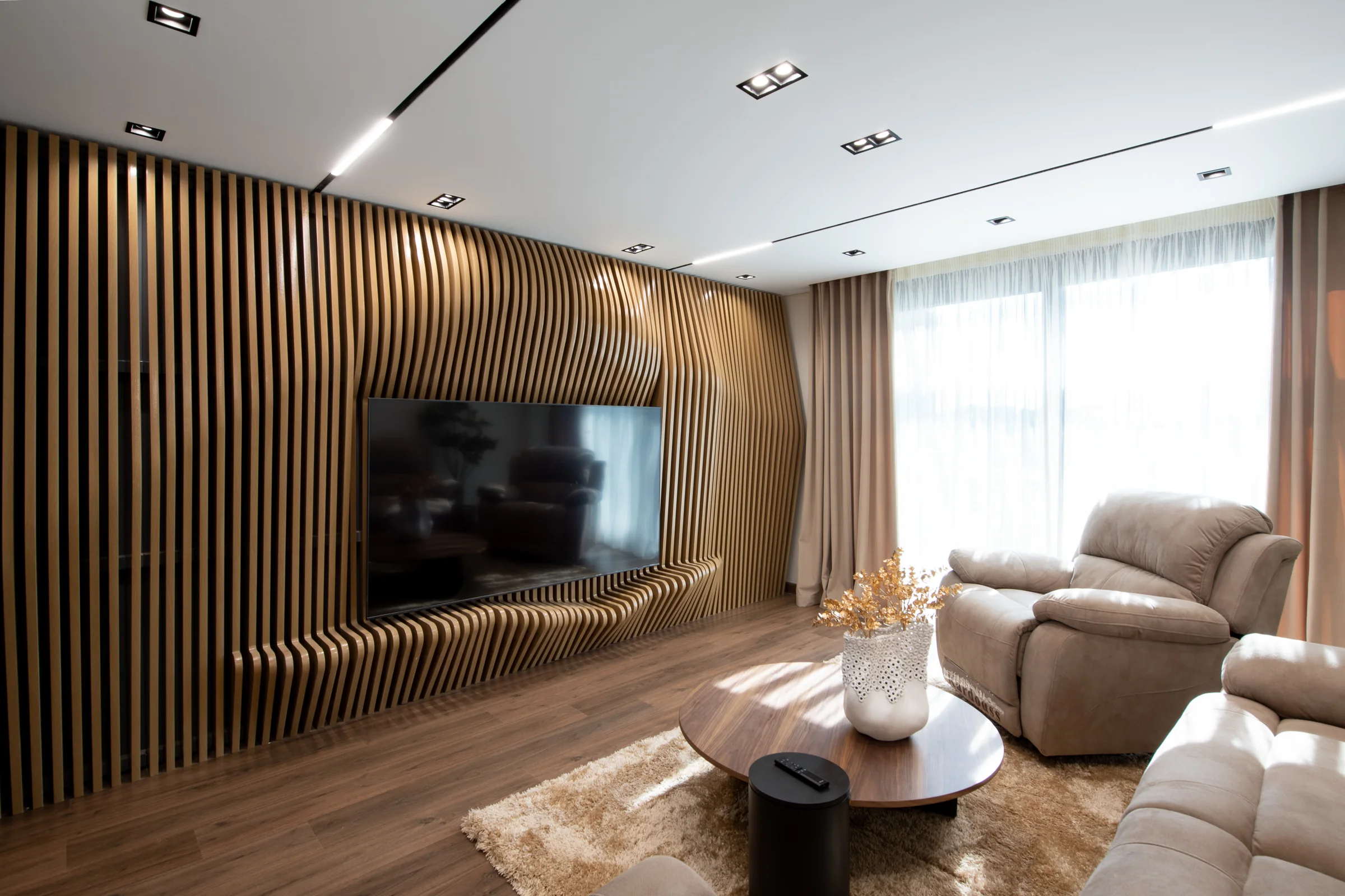 Seating and slatted wall in afternoon light.
