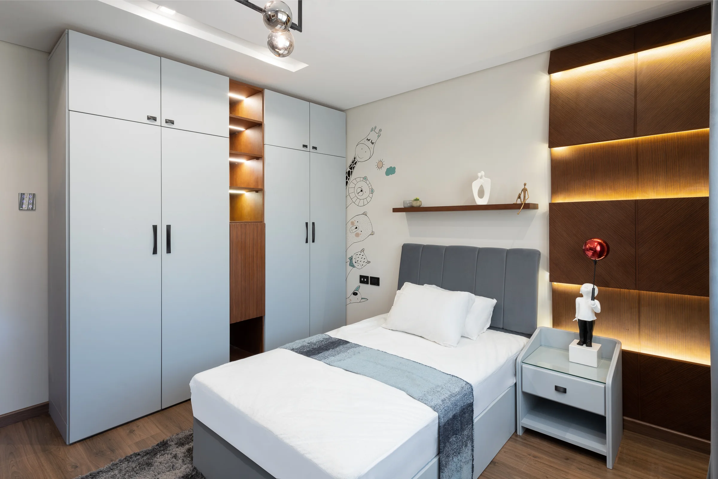 Bedroom with fitted wardrobes and a warm cove.