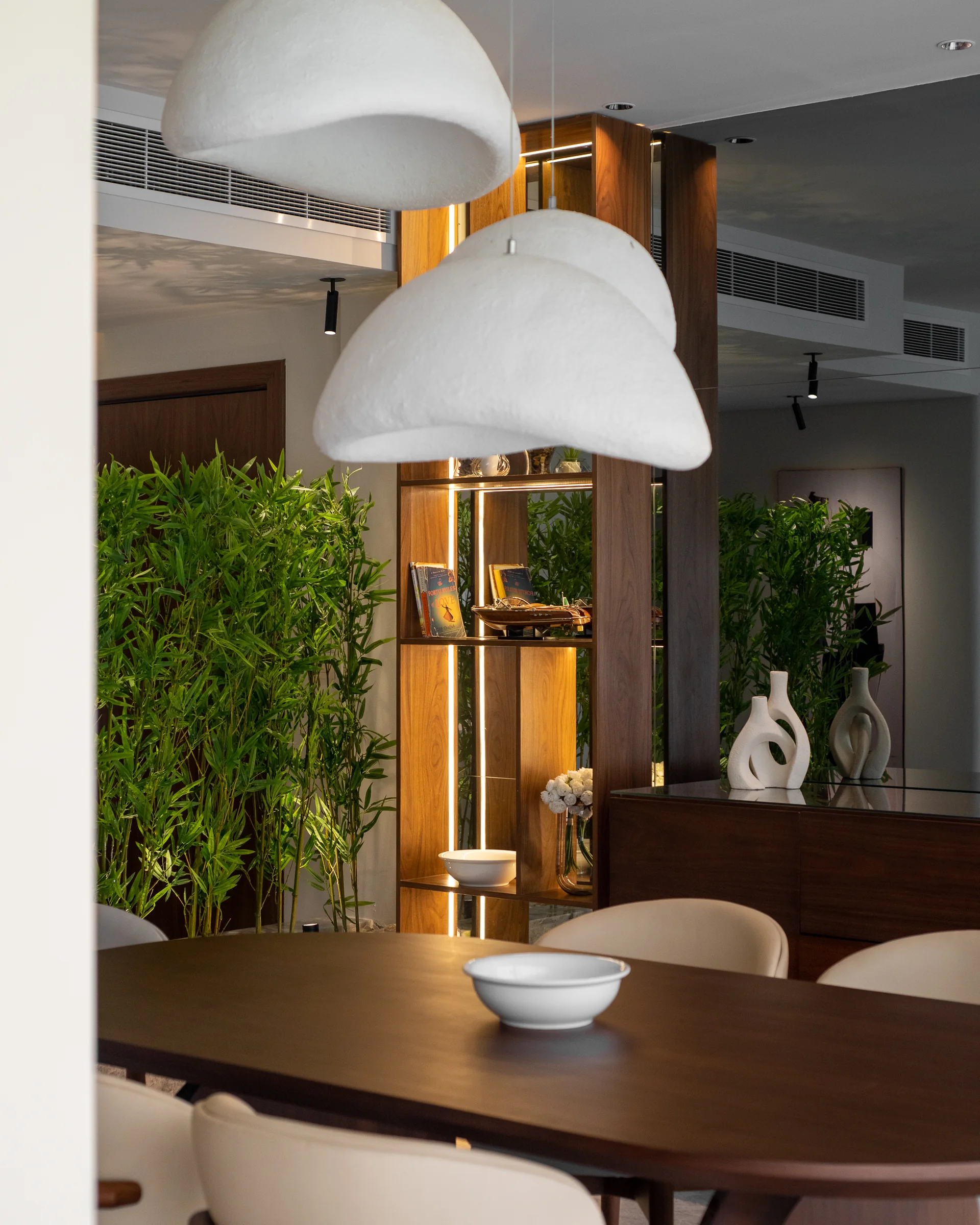 Pendant and table with bamboo in the foreground.