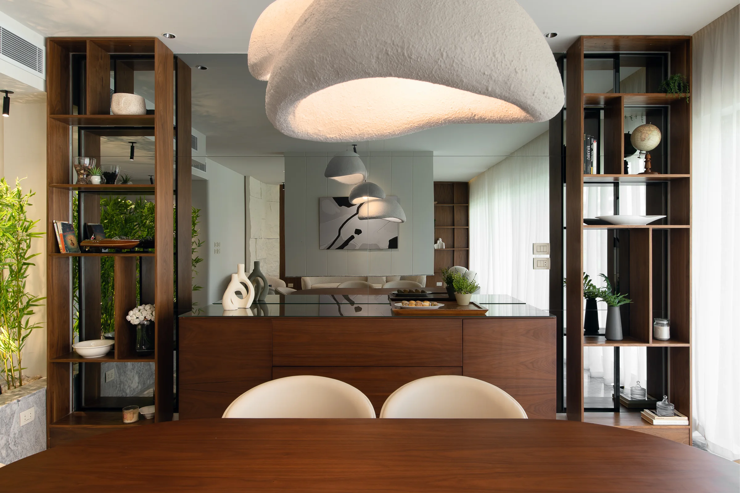 Kitchen counter and open walnut shelving.