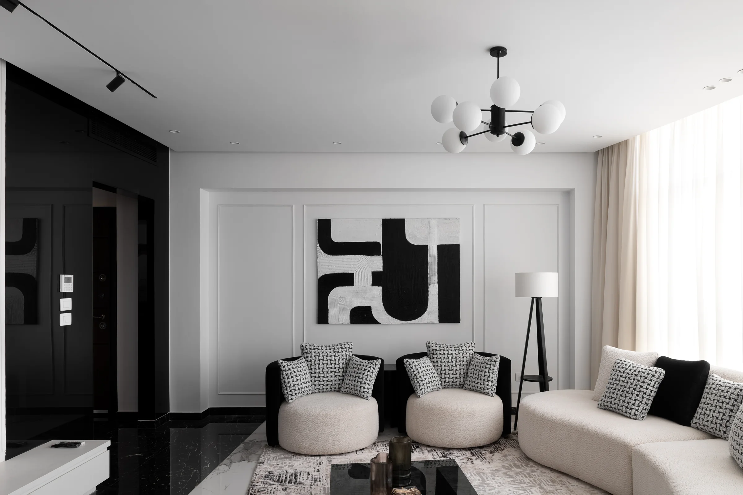 Living room with the artwork centred behind the sofa.
