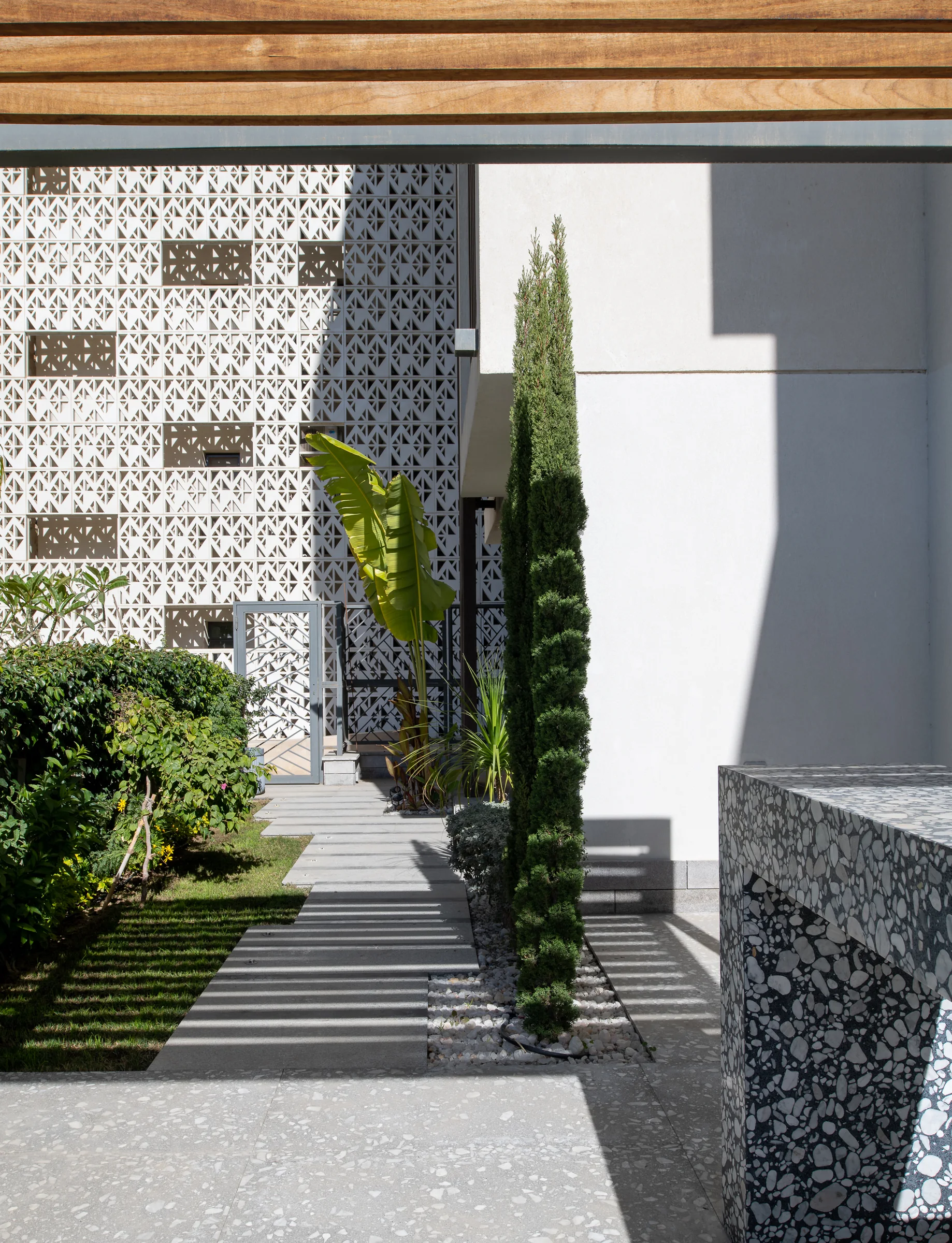 The courtyard from the far end, planting along the wall.