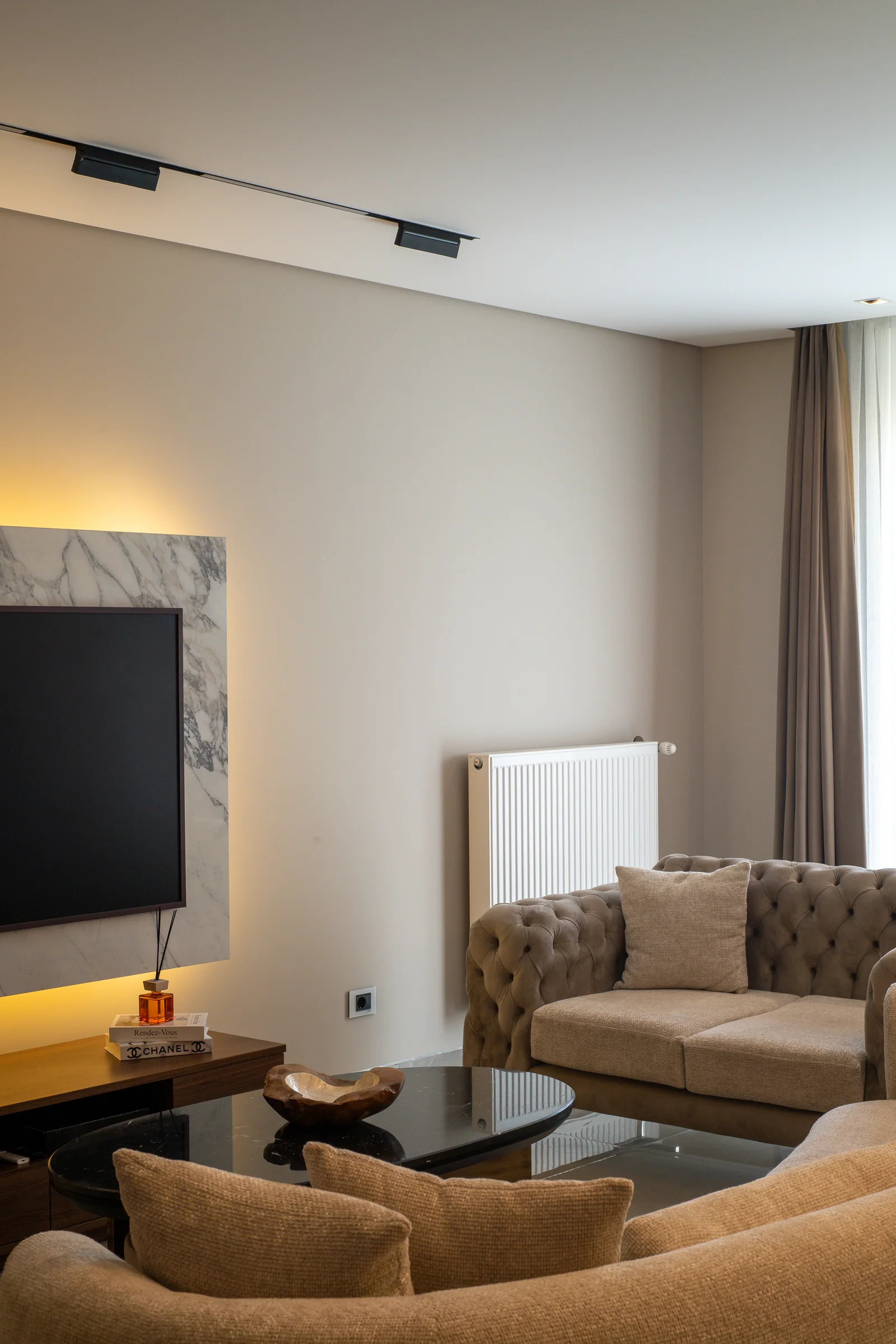Seating group with the television wall and radiator niche.
