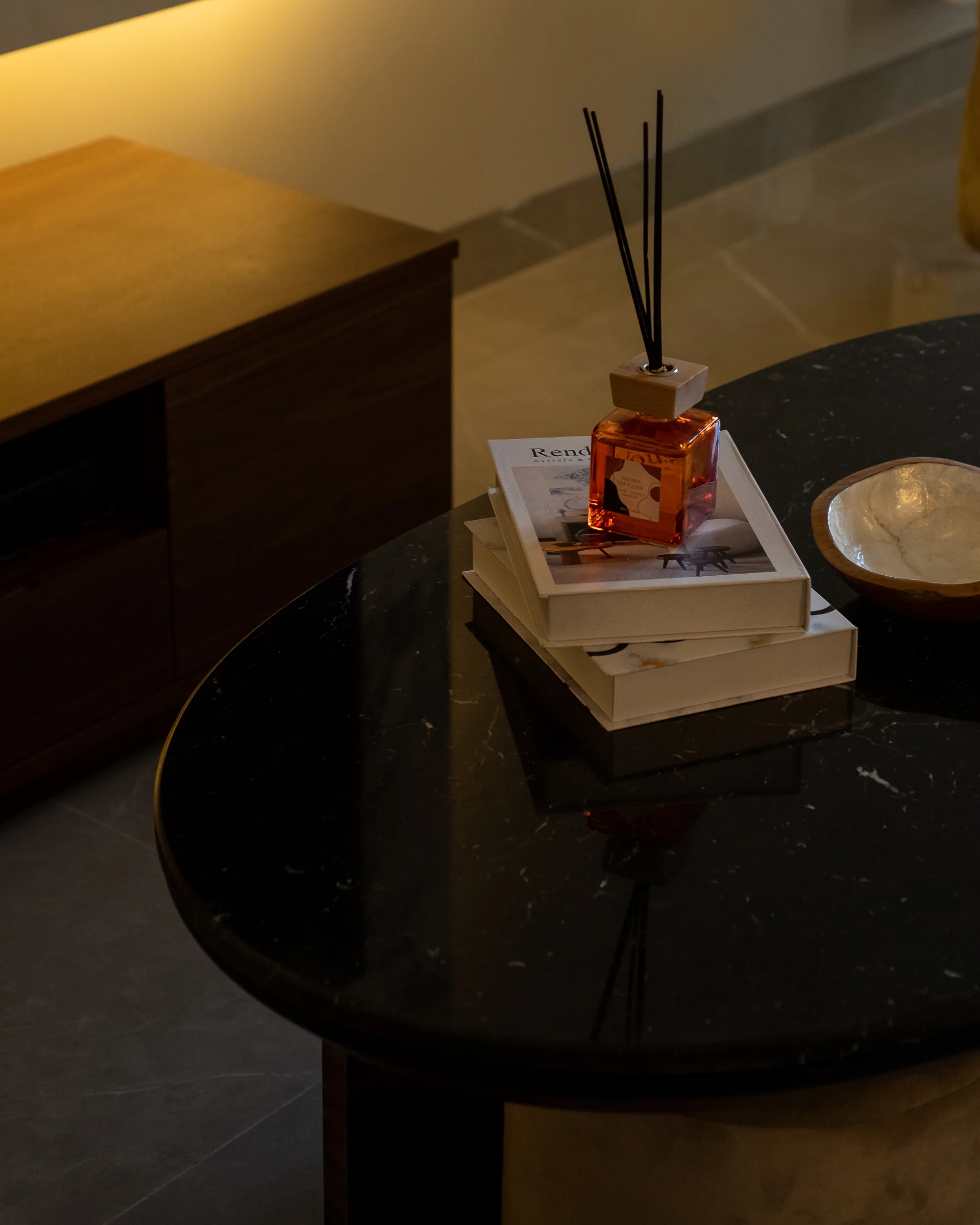 The same table close, reflection in the stone.
