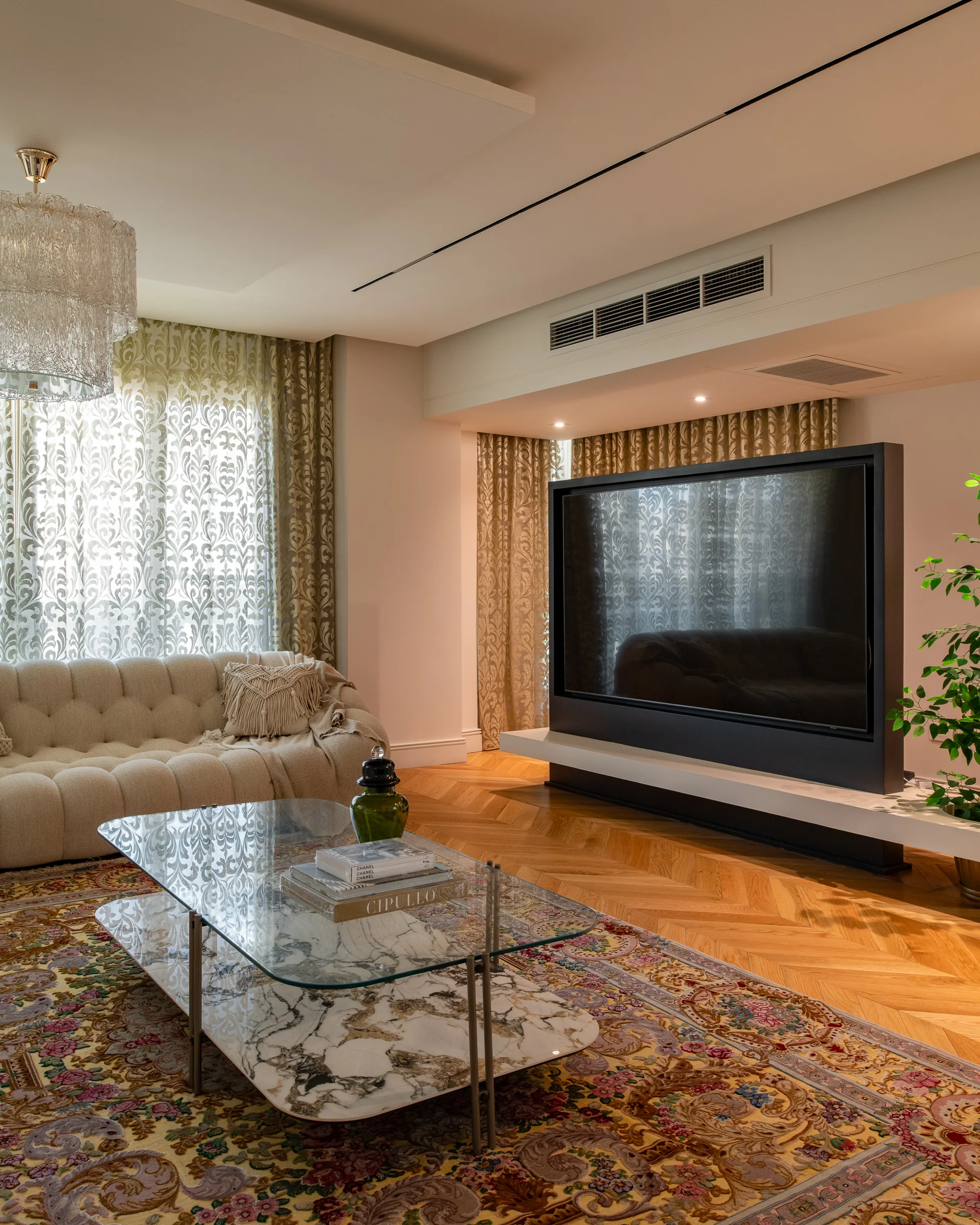 The same room from the corner, parquet meeting the rug.